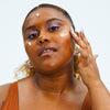Woman applying Urban Skin RX After Breakout Treatment Fade & Clarify Serum to her face