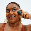 Woman applying Urban Skin RX After Breakout Treatment Fade & Clarify Serum to her face