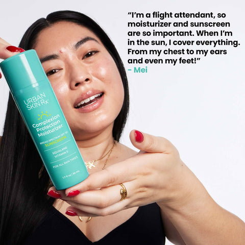 Woman holding bottle of USRX Complexion Protection Moisturizer Sunscreen with SPF 30 
