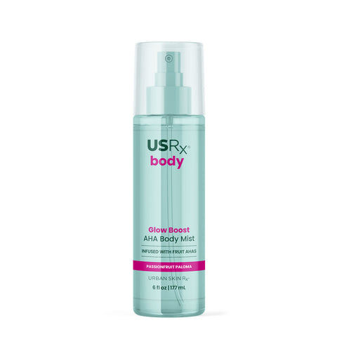 Bottle of USRX Glow Boost AHA Body Mist in Passionfruit Paloma on white background