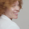 Woman applying Urban Skin RX Even Tone Smoothing Body Treatment to her skin