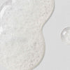 Clear sample of Lacticglow Micropolish Gentle Cleansing Gel with microbeads that gently exfoliate