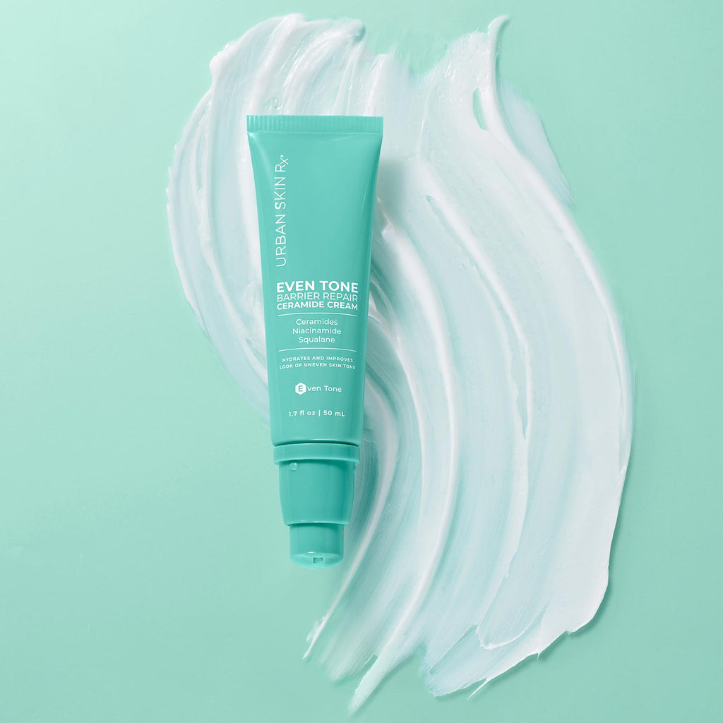 1.7 ounce bottle of Urban Skin RX Even Tone Barrier Repair Ceramide Cream next to a sample of product on light green background