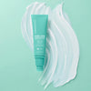 1.7 ounce bottle of Urban Skin RX Even Tone Barrier Repair Ceramide Cream next to a sample of product on light green background