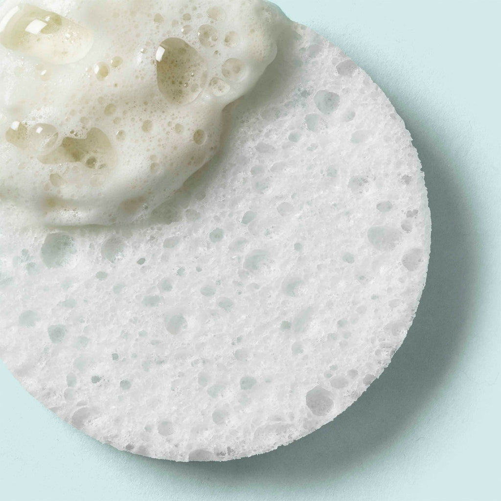 Lather of the Even Tone Cleansing Bar applied to a cleansing sponge