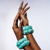 Woman wearing Urban Skin RX water cuffs for catching water while washing face